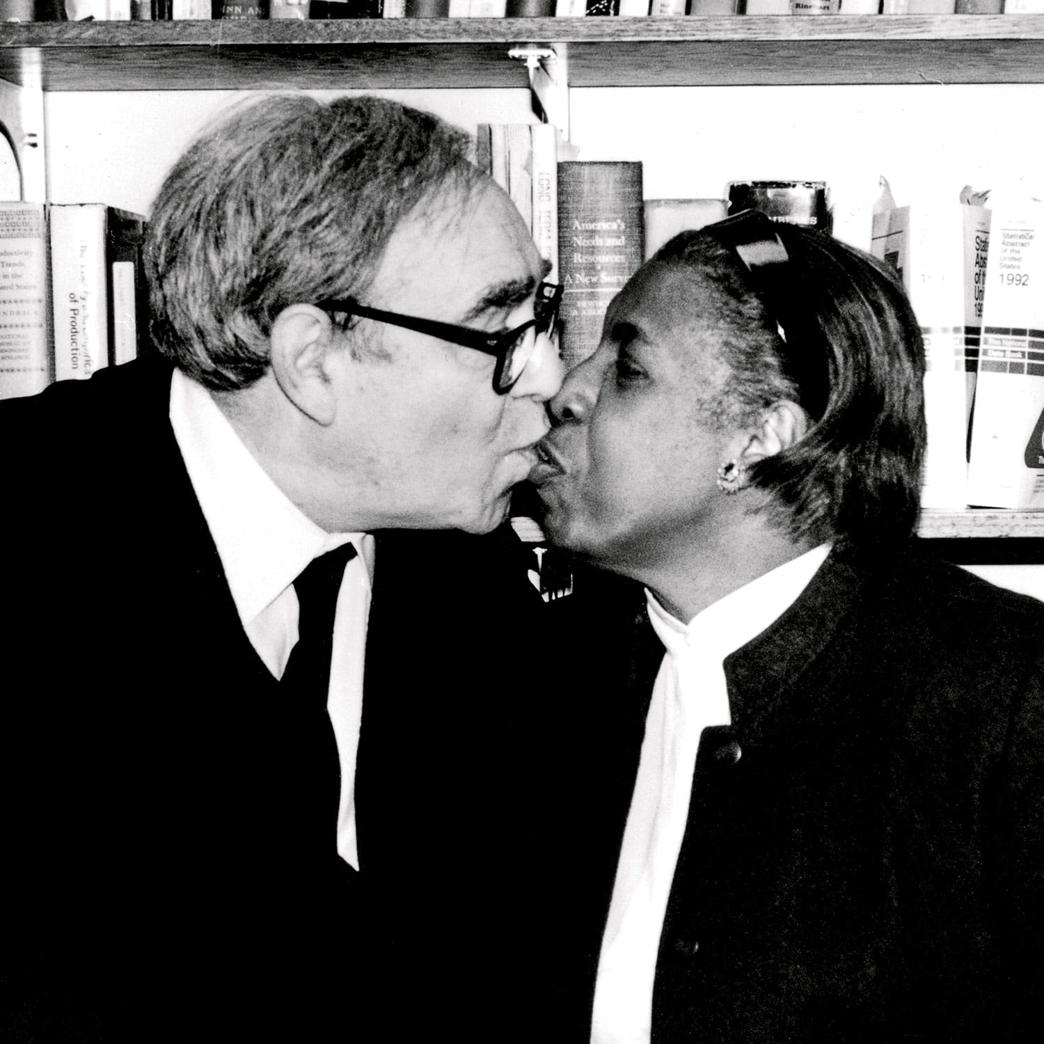 Photo of Robert Fogel kissing his wife Enid