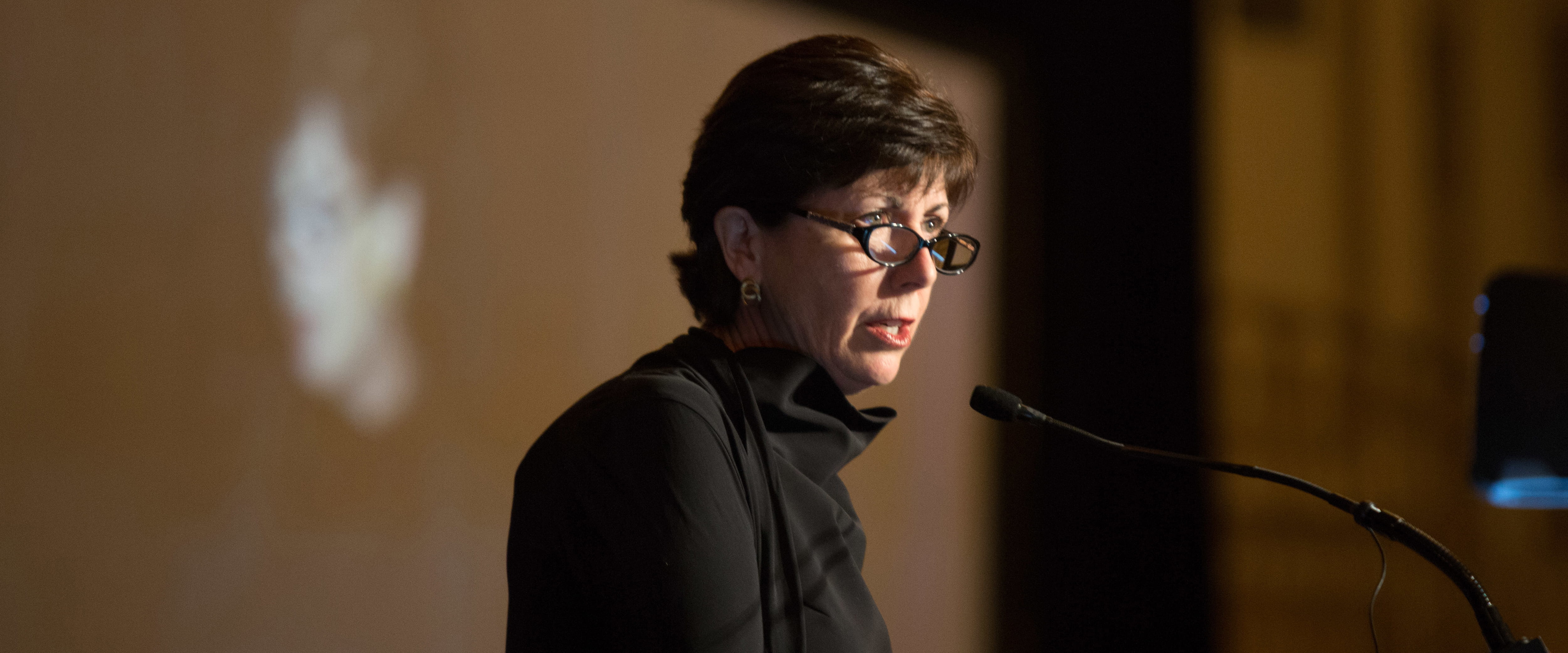 Roxanne M. Martino, Council on Chicago Booth member, at lectern
