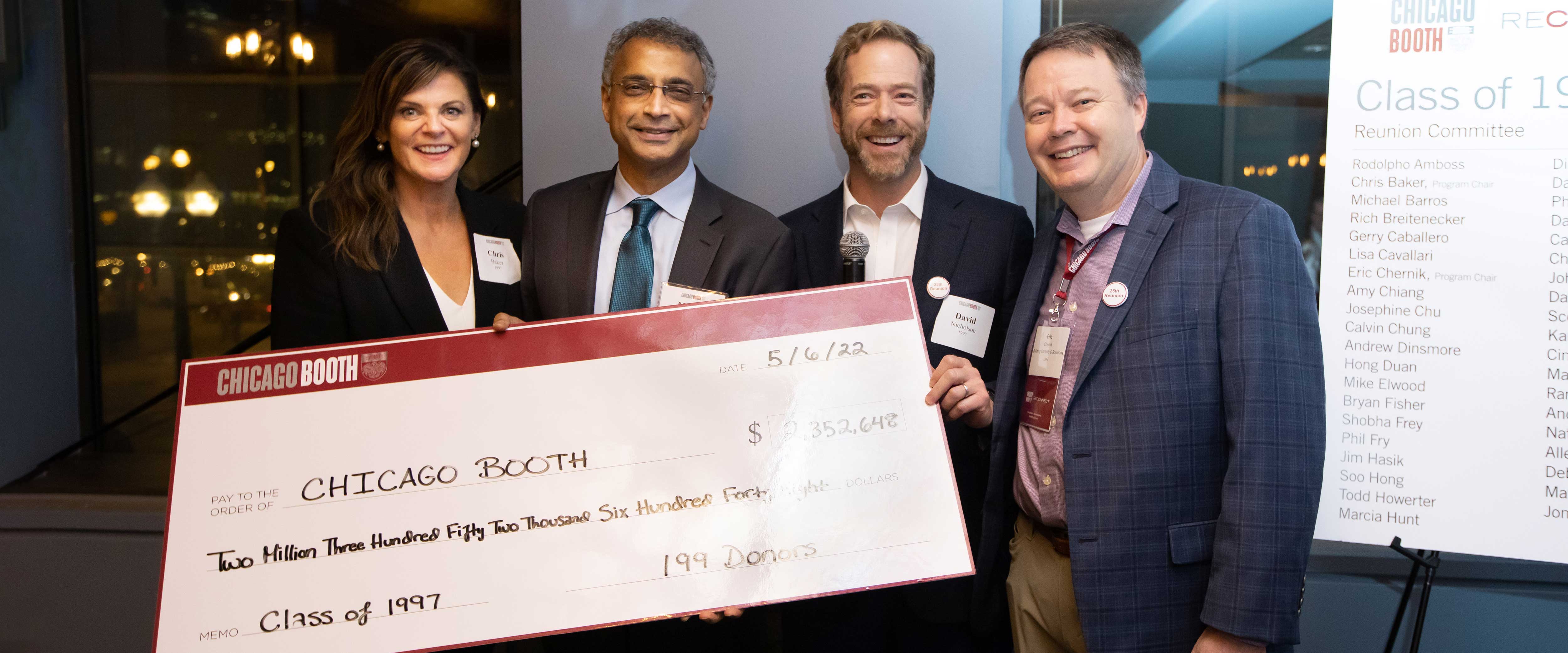 Large gift check from Chicago Booth class of 1997 donating $2,352,600.00