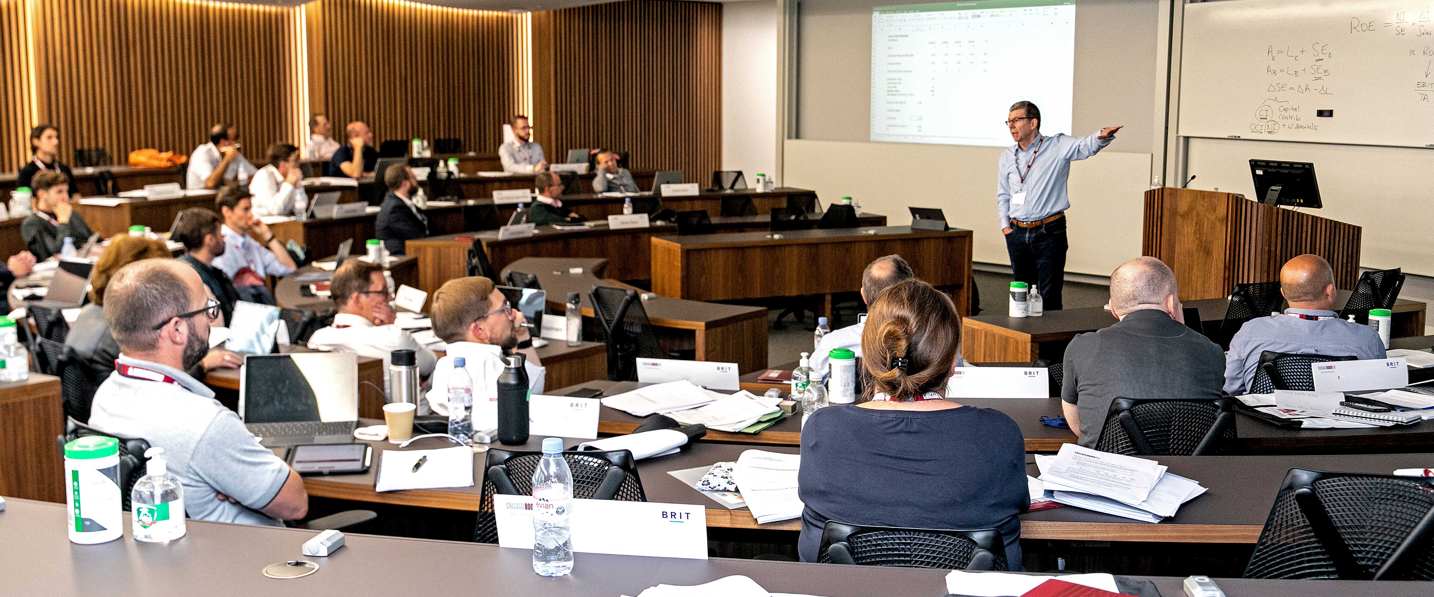 Chicago Booth students listening to a lecture by Douglas Skinner