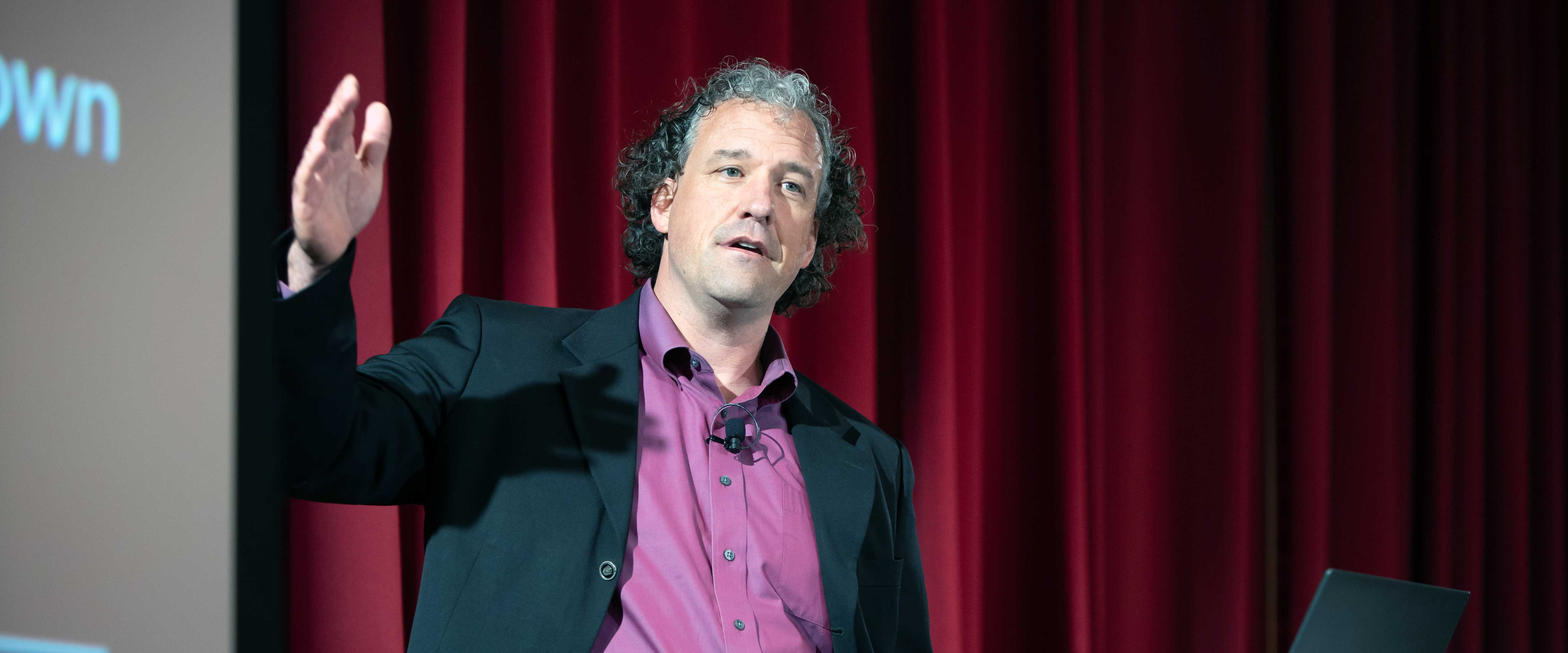 Nicholas Epley presenting at a behavioral science event