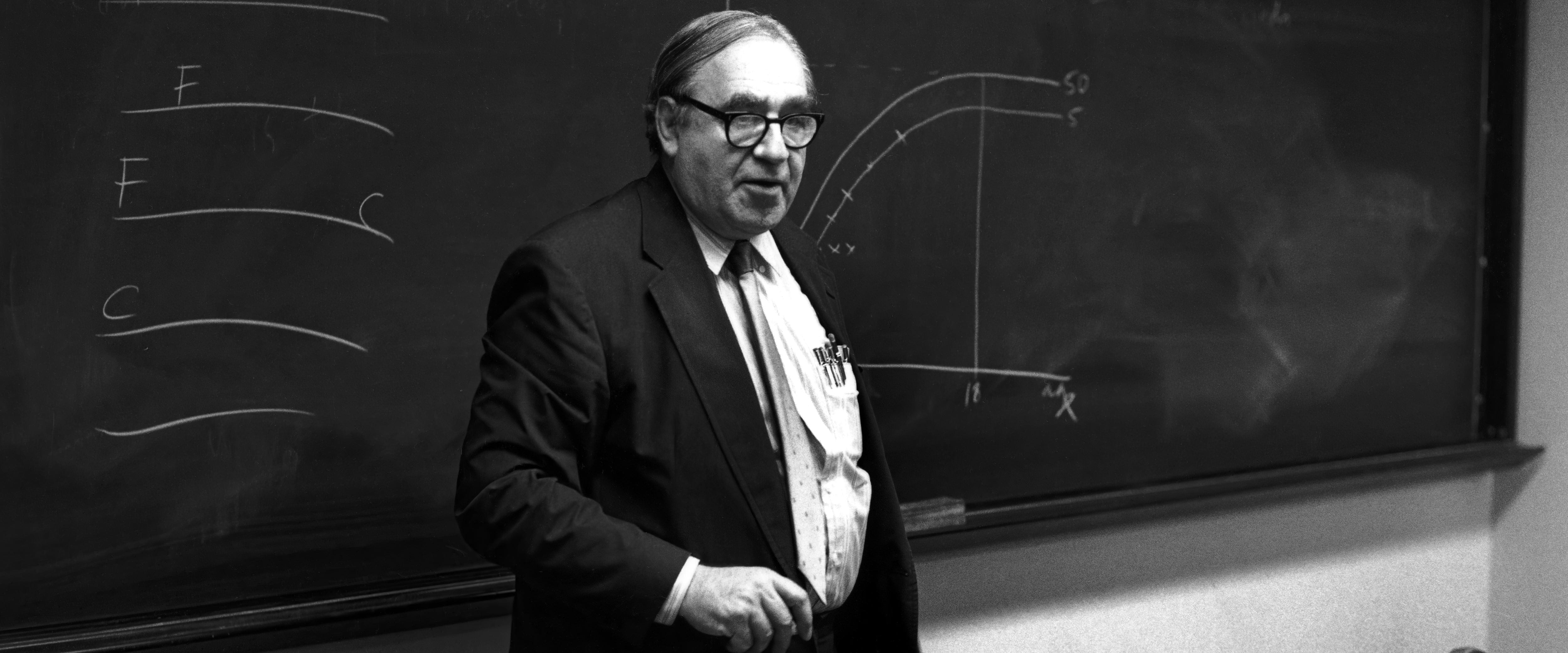 Robert Fogel teaching at a blackboard
