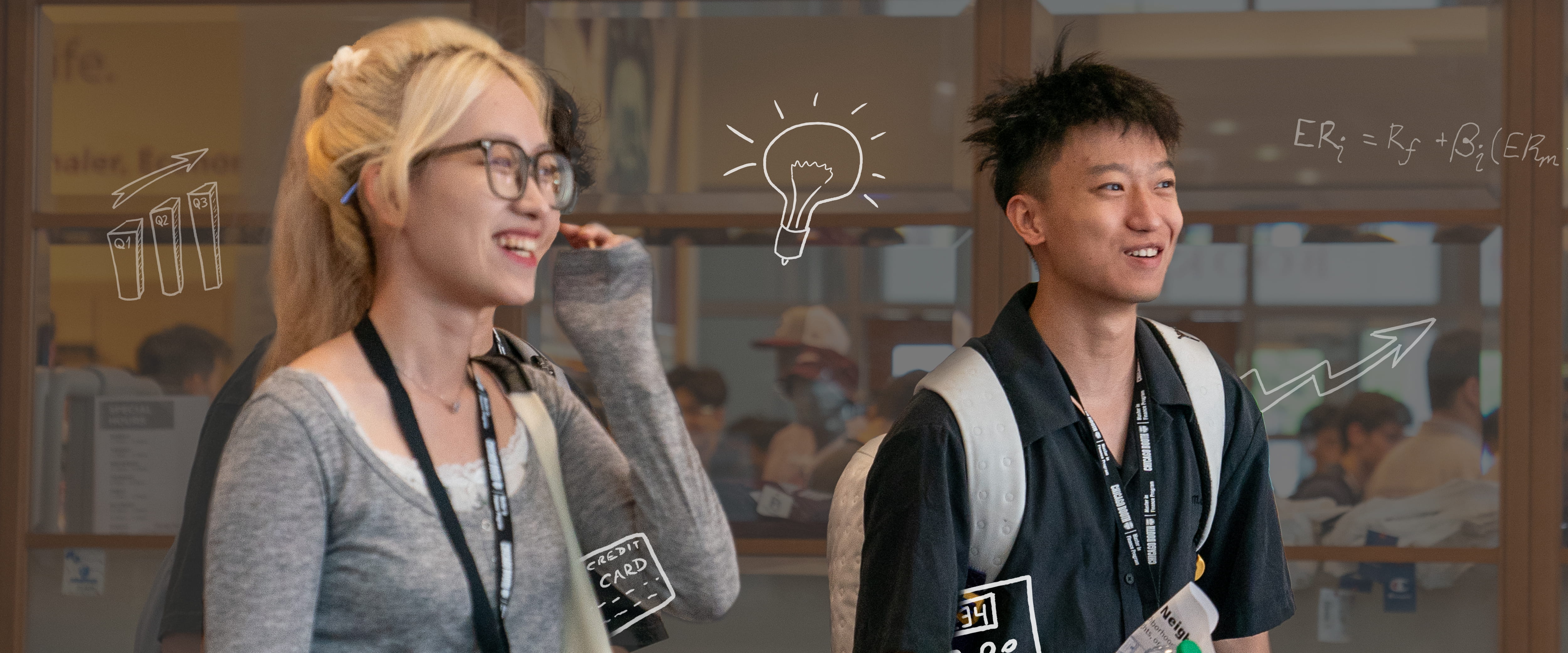 Two finance students laughing and smiling coming out of class