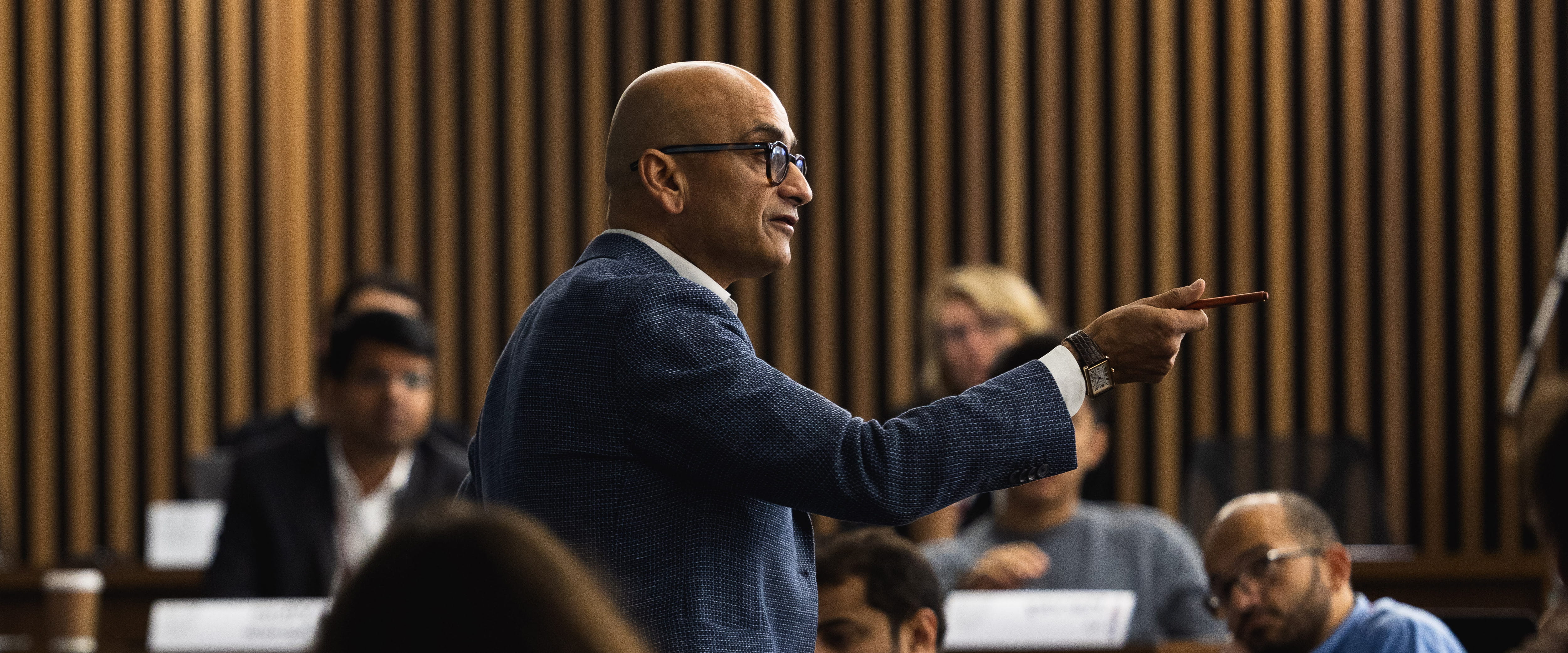 A professor speaking to a class.