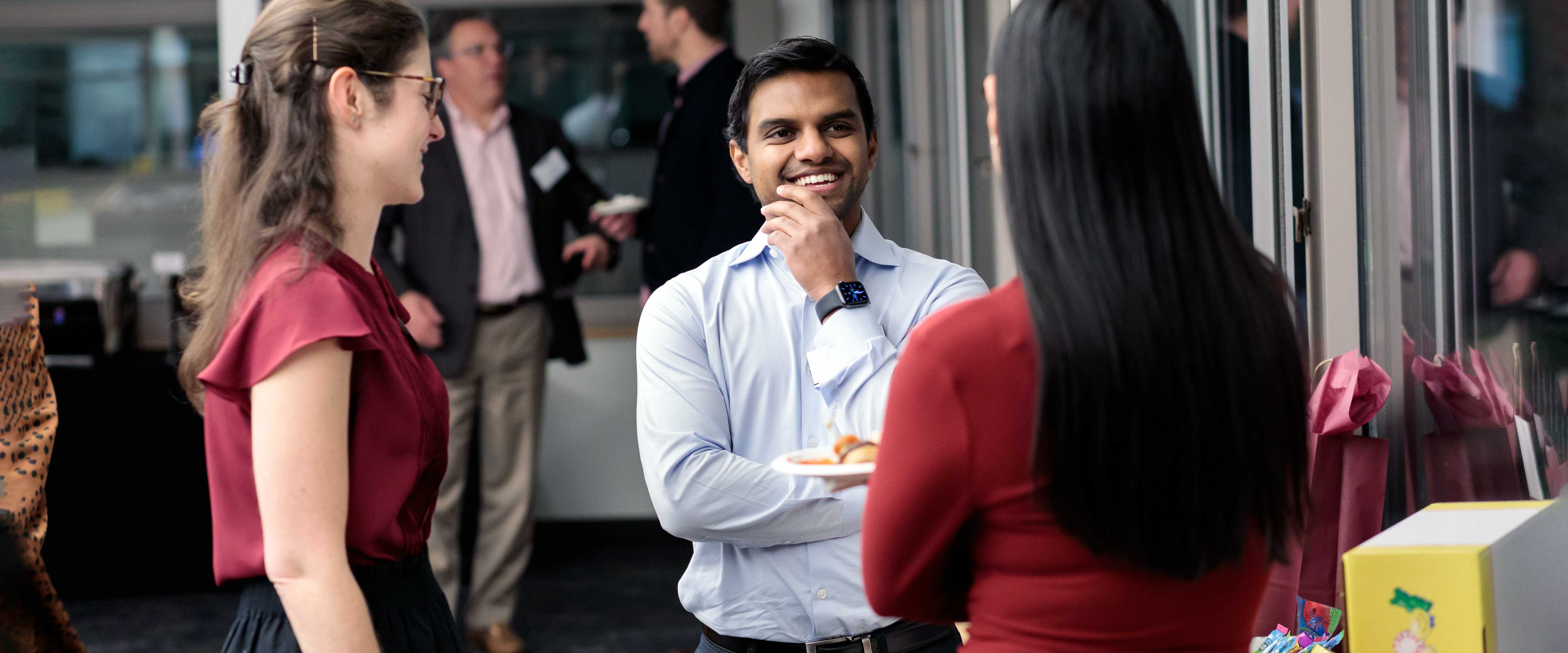 Booth student speaking with a speaker at the Kilts Case Competition