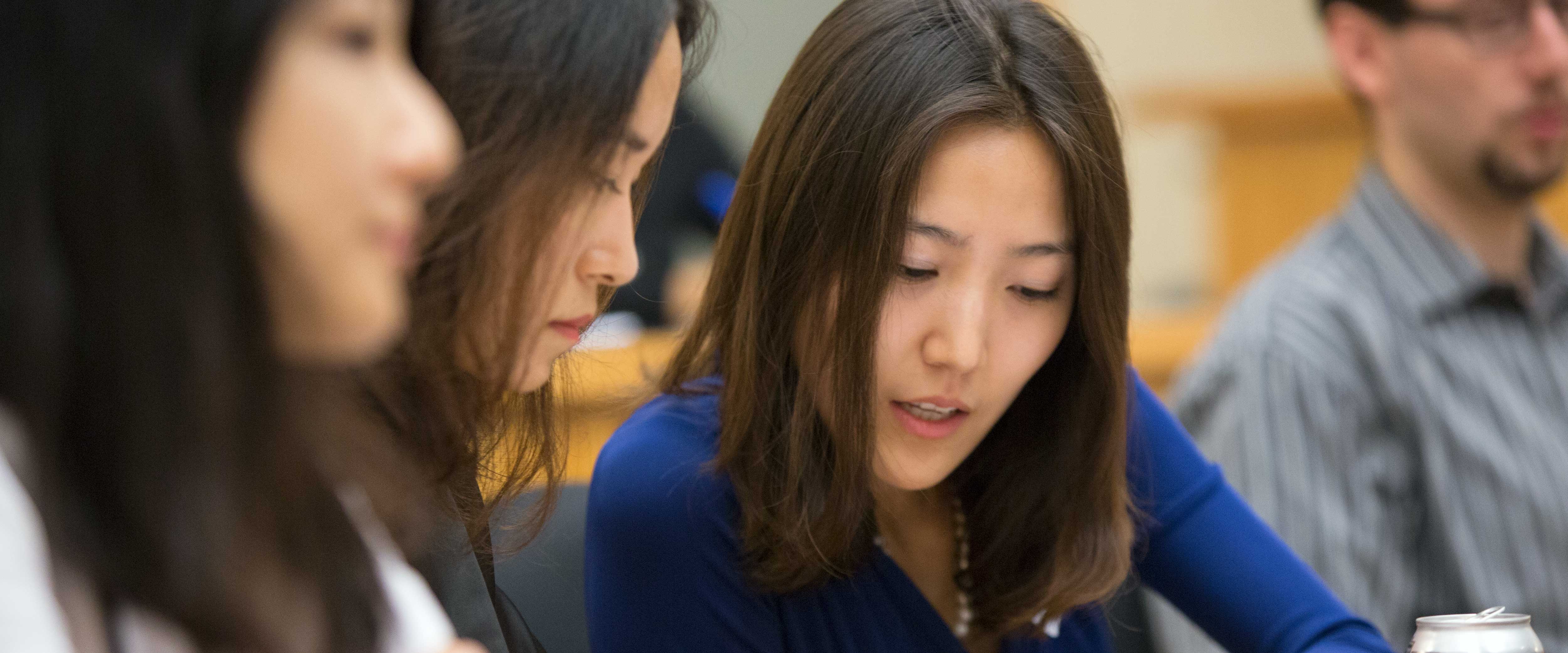 Two Chicago Booth female students collaborating 