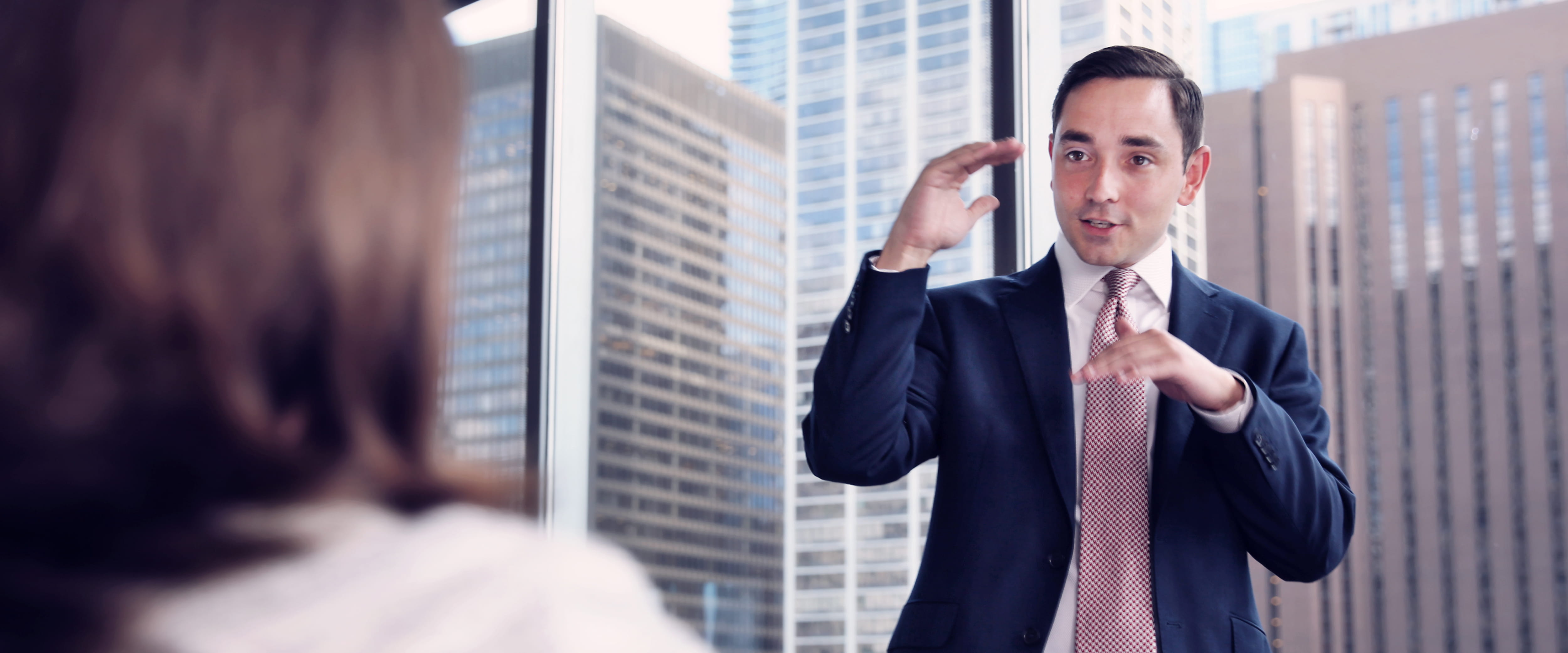 Investment banker talking to a client