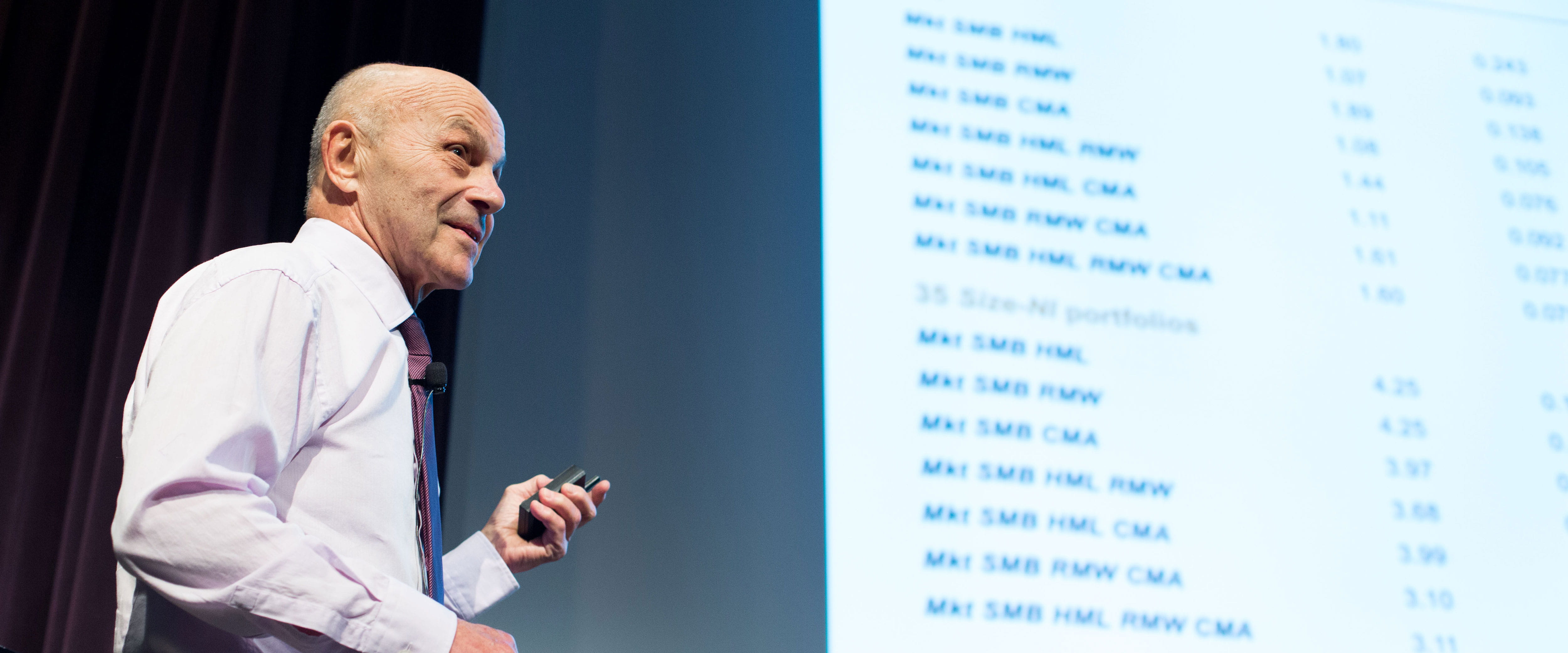 Professor Fama, presenting on stage