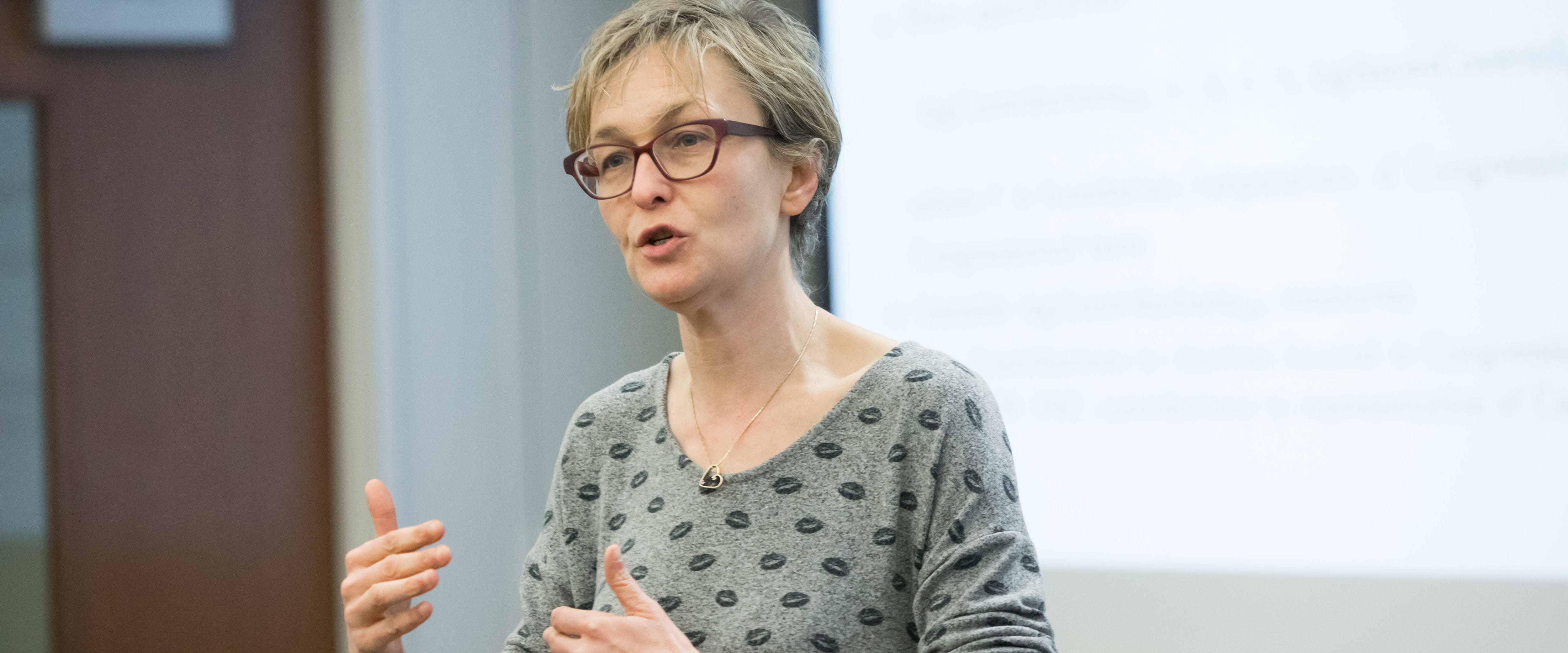 Professor Marianne Bertrand teaching in front of a class