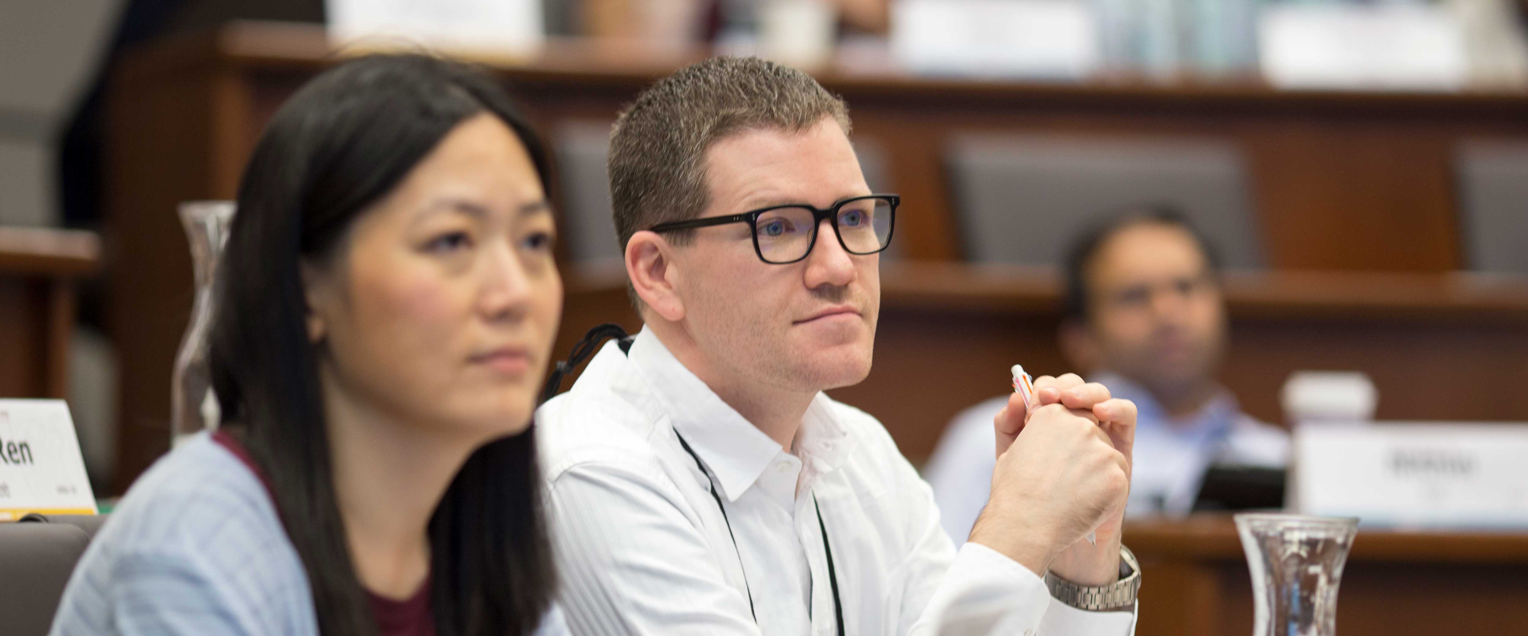 Female and male student in class
