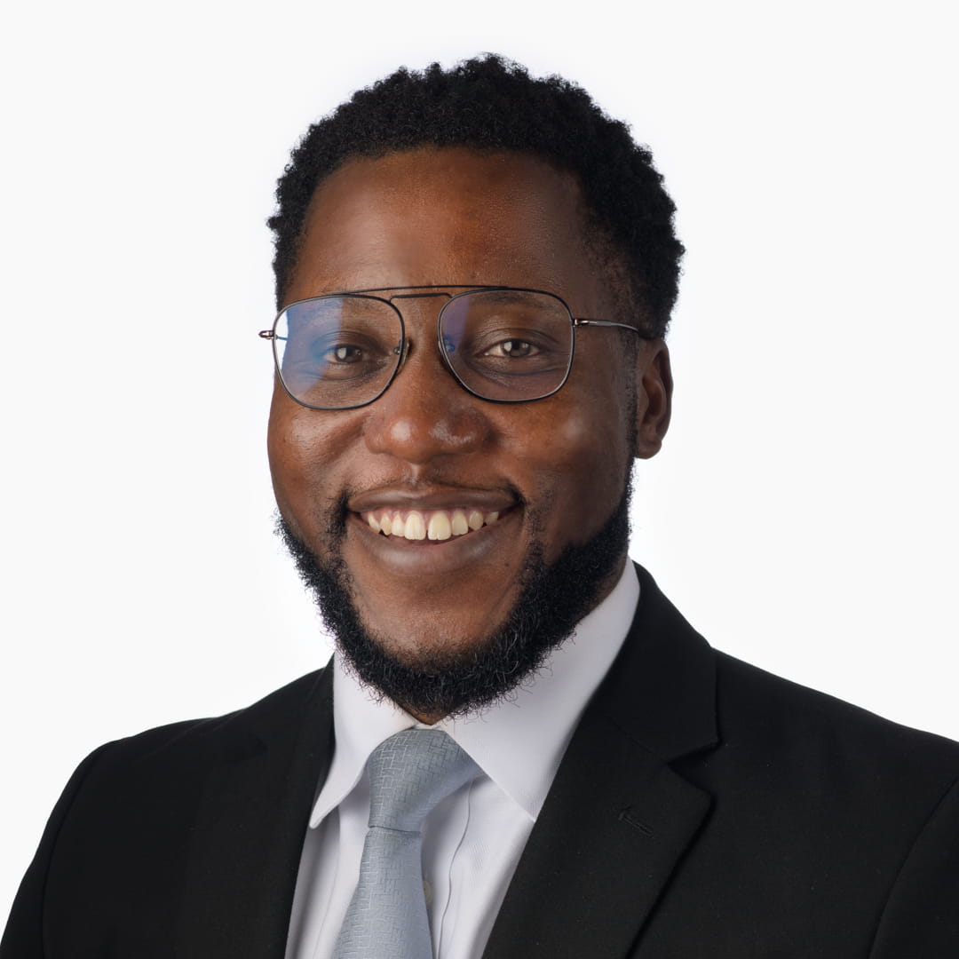 A man smiles at the camera