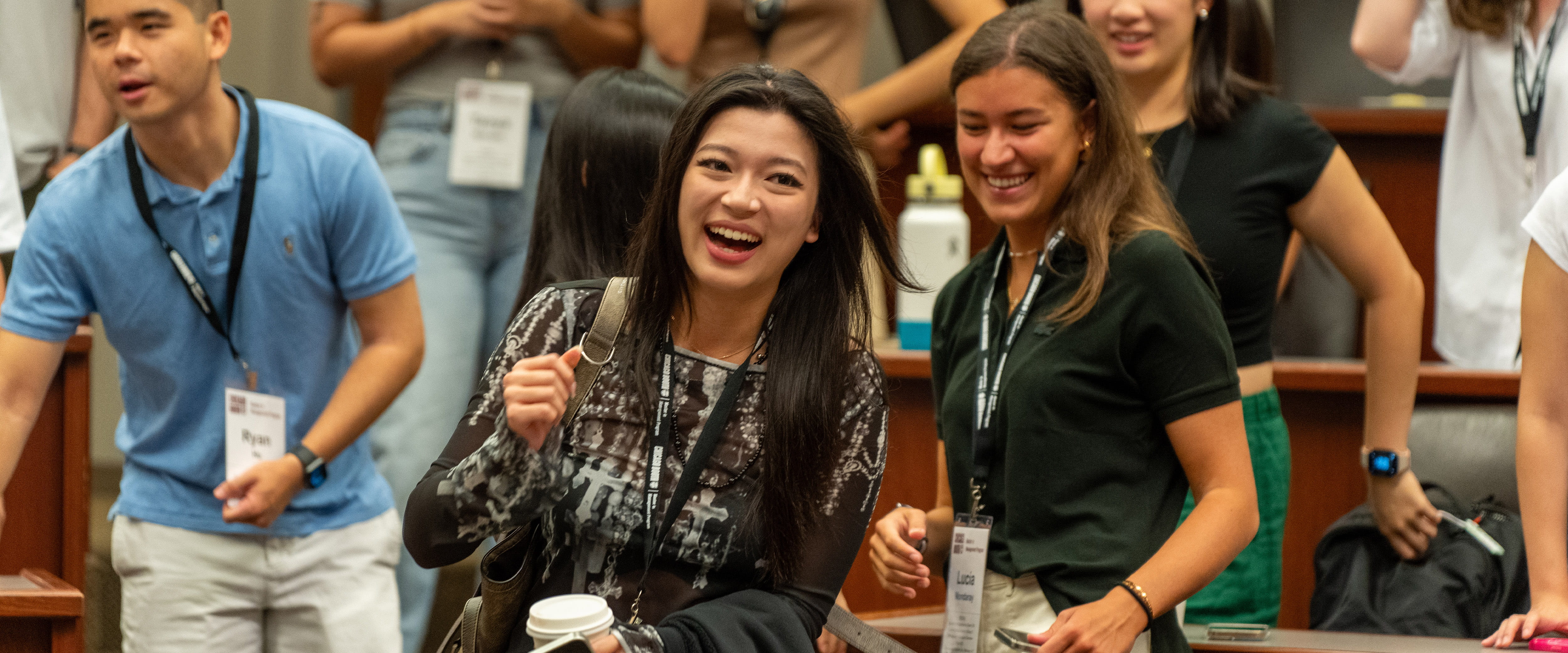 Students smiling in classroom.