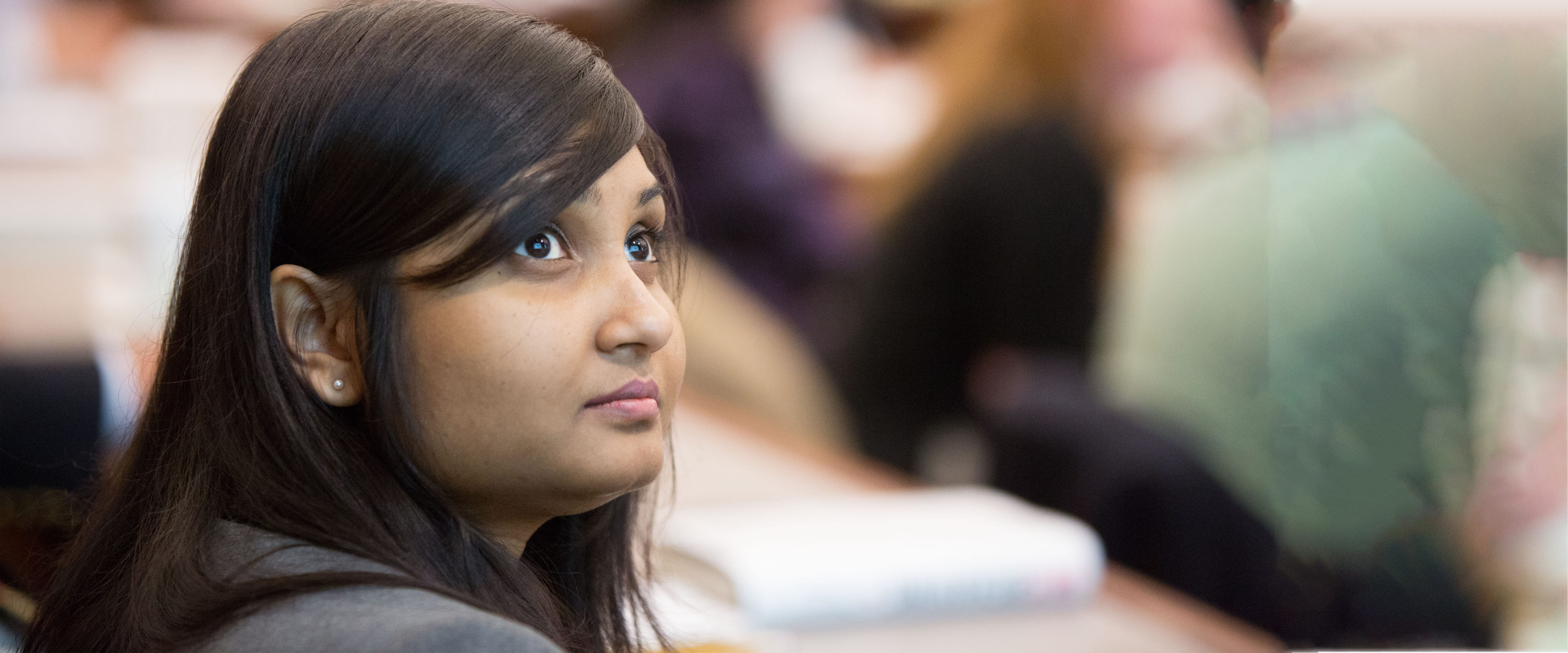 Group in a lecture hall applauding