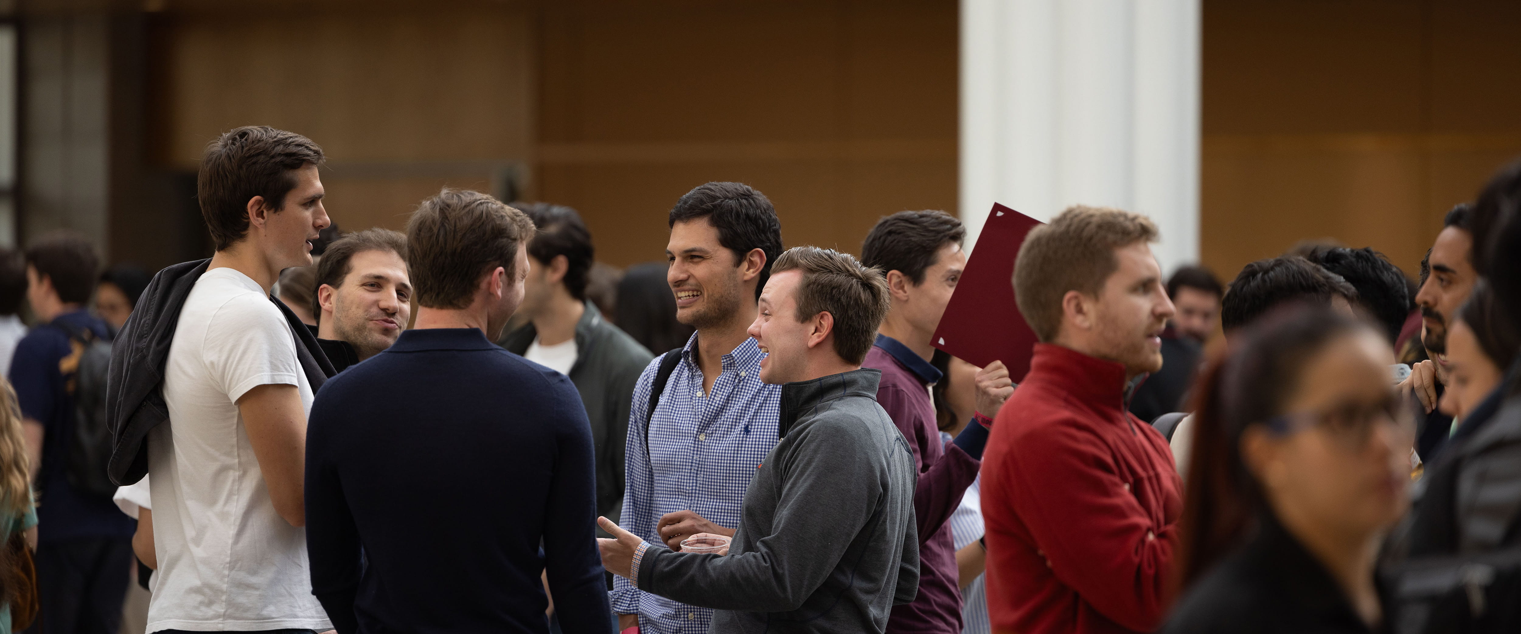 Group of students socializing inside Harper Center